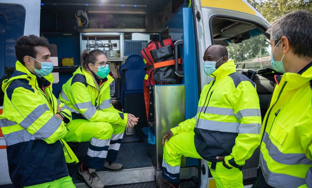 volunteers wearing face masks and safety gear